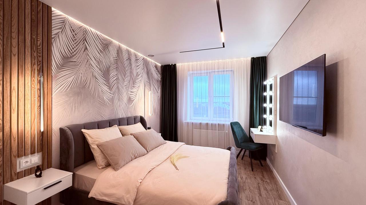 Real photos of One-bedroom apartment with a large kitchen, living room, fireplace, panoramic windows and city views.