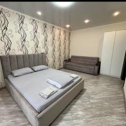 Фото Апартаменты Happy Home(ХэппиХоум) на улице Зураба Магкаева 83/3