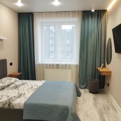 Фото Отель Современная двухкомнатная квартира с кухней-гостиной