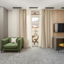 Фото Отель Ikos Polyana