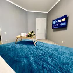 1-комнатные апартаменты люкс на 17 этаже с видом на реку Тура