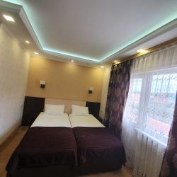 Номер улучшенный семейный с 4 односпальными кроватями