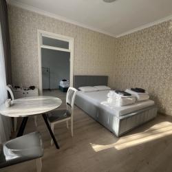 Фото Апартаменты Happy Home(ХэппиХоум) на улице Зураба Магкаева 83/3