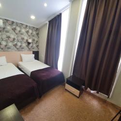 Номер улучшенный семейный с 4 односпальными кроватями