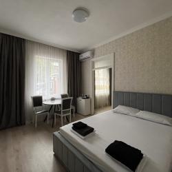 Фото Апартаменты Happy Home(ХэппиХоум) на улице Зураба Магкаева 83/3