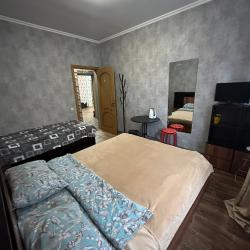 Номер эконом улучшенный с двуспальной и односпальной кроватью/диваном (общие удобства)