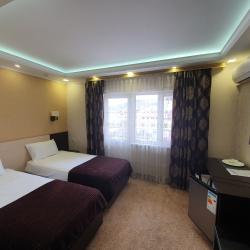 Номер улучшенный семейный с 4 односпальными кроватями