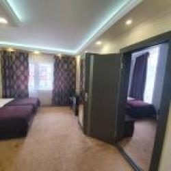 Номер улучшенный семейный с 4 односпальными кроватями