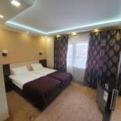 Номер улучшенный семейный с 4 односпальными кроватями