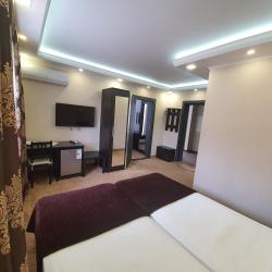 Номер улучшенный семейный с 4 односпальными кроватями