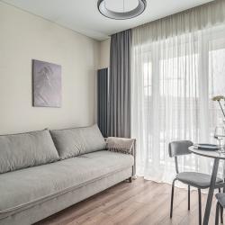 Фото Апартаменты V GОSТIАН U NАSТI на улице Академика Ландау 9