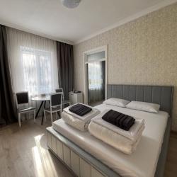 Фото Апартаменты Happy Home(ХэппиХоум) на улице Зураба Магкаева 83/3