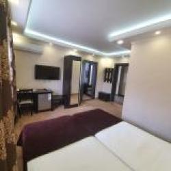 Номер улучшенный семейный с 4 односпальными кроватями