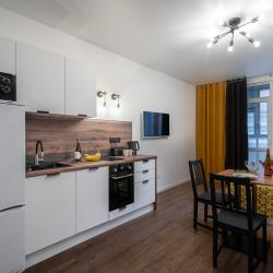 Апартаменты студия RoomyRoom Yellow у Клиники Алмазова