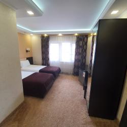 Номер улучшенный семейный с 4 односпальными кроватями