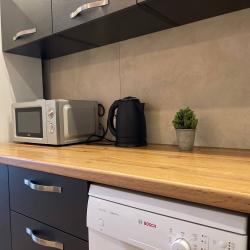 Фото Отель Новая квартира с кроватью возле панорамного окна, высокий этаж