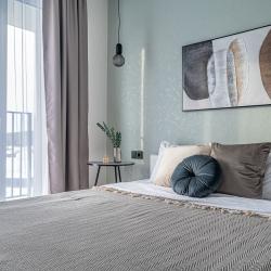 Фото Апартаменты V GОSТIАН U NАSТI на улице Академика Ландау 9