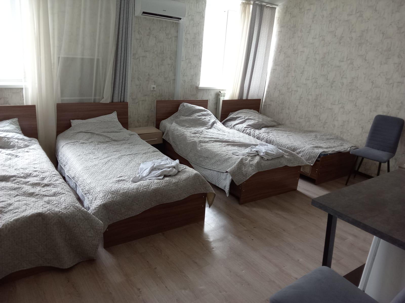 Номер стандарт семейный с 4 односпальными кроватями