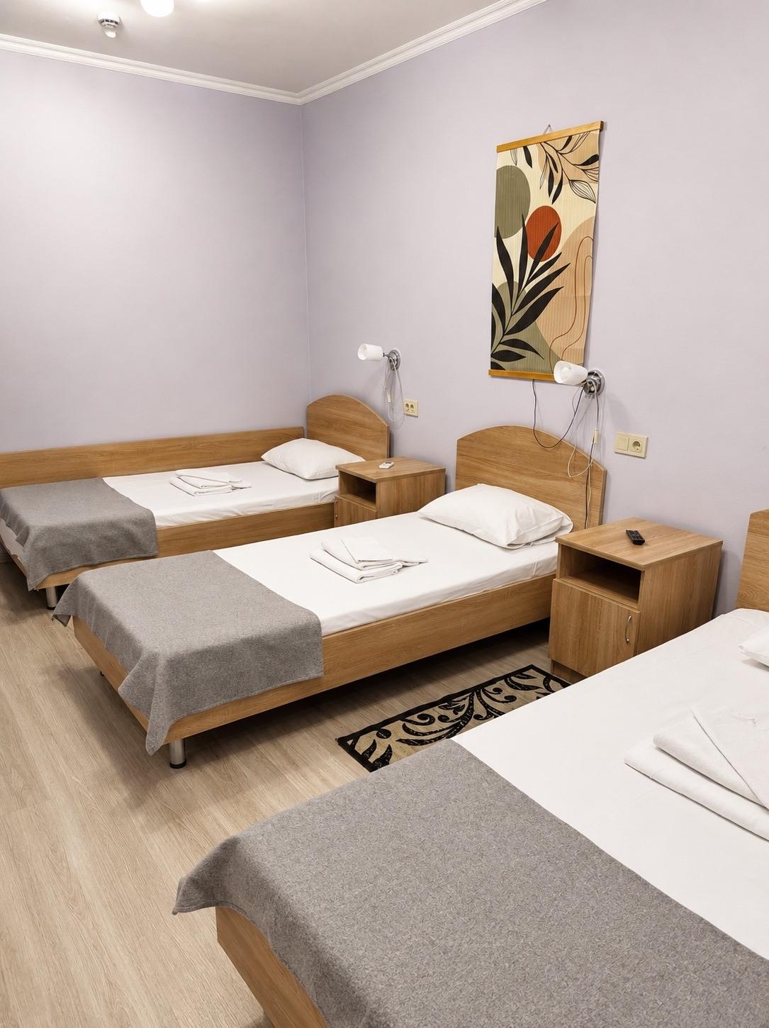 Номер улучшенный с 4 односпальными кроватями (корпус Б) 2