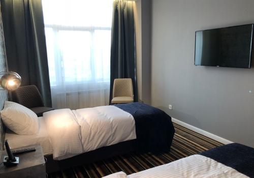 Номер делюкс с 2 односпальными кроватями