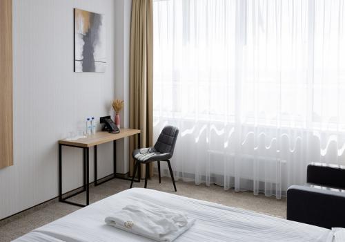 Номер стандарт бизнес с 1 двуспальной кроватью