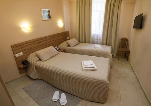 Номер стандарт бизнес с 2 односпальными кроватями