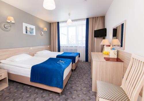 Номер стандарт бизнес с 2 односпальными кроватями