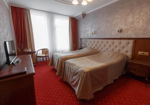 Номер стандарт с 2 односпальными кроватями (без окна)