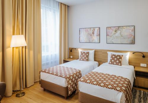 Номер студия стандарт с 2 односпальными кроватями