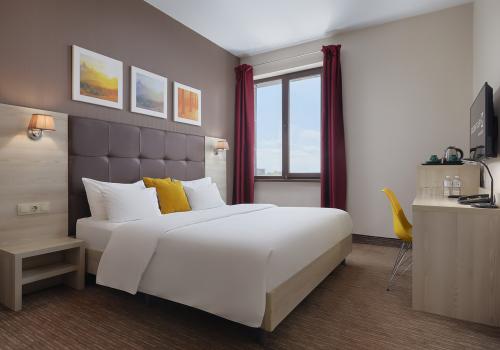 Номер стандарт комфорт с 1 двуспальной кроватью