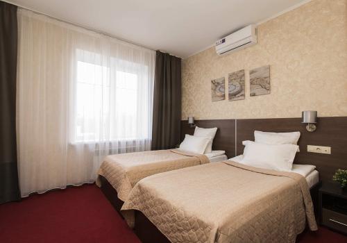 Номер стандарт улучшенный с 2 односпальными кроватями