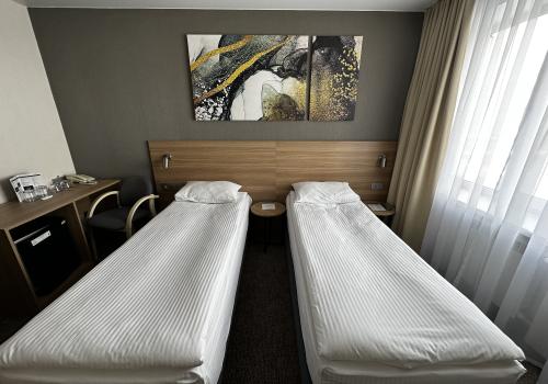 Номер улучшенный стандарт с 2 односпальными кроватями