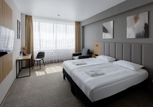 Номер стандарт бизнес с 1 двуспальной кроватью