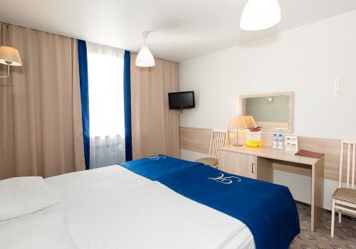 Номер стандарт бизнес с 1 двуспальной кроватью