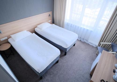 Номер стандарт улучшенный с 2 односпальными кроватями