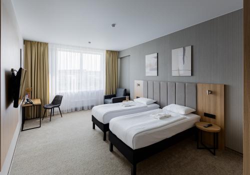 Номер стандарт бизнес с 2 односпальными кроватями