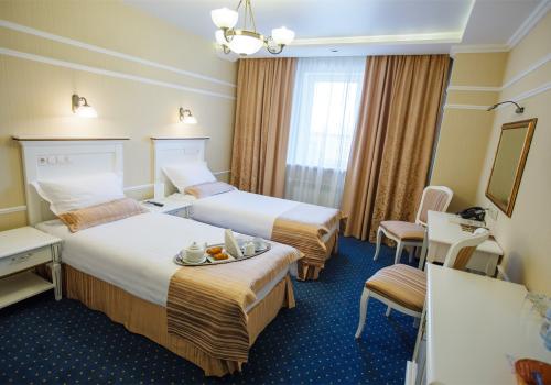 Cтандарт с 2 односпальными кроватями с балконом