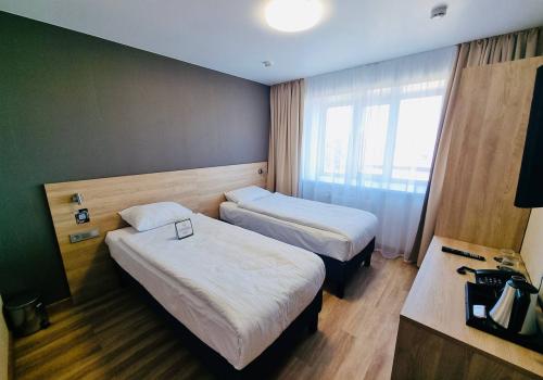 Номер стандарт эконом с 2 односпальными кроватями (удобства на этаже)