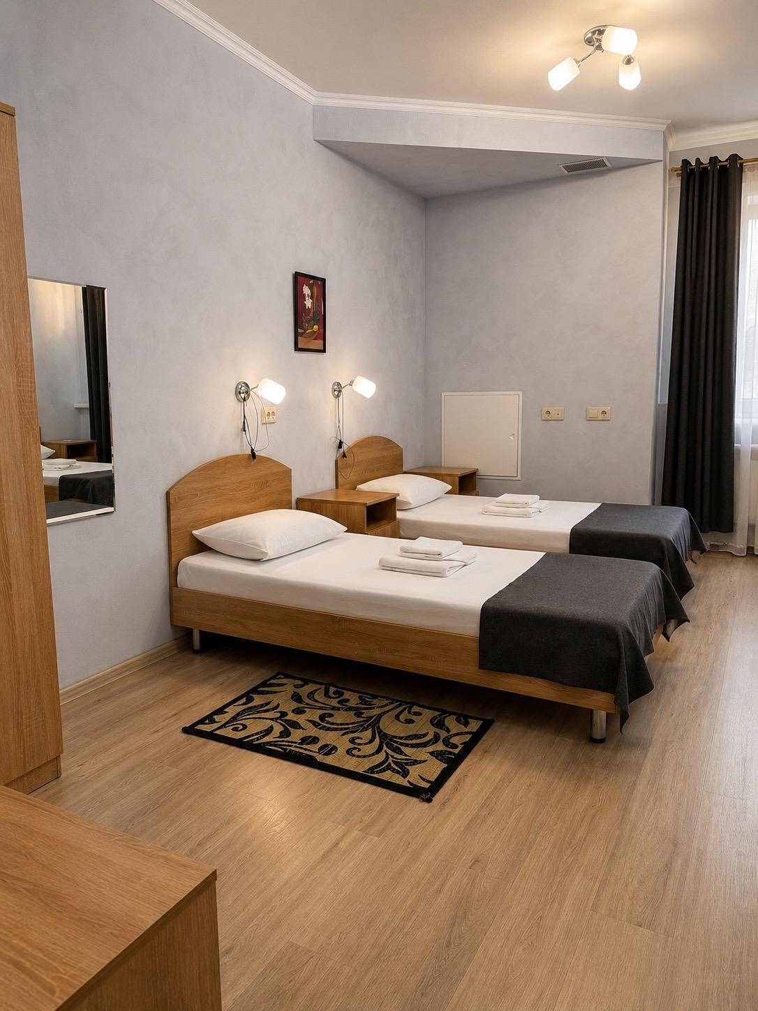 Номер улучшенный с 4 односпальными кроватями (корпус Б) 3
