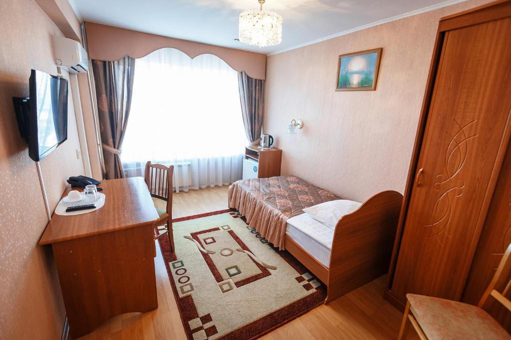 Номер улучшенный с 1 односпальной кроватью (с завтраком) 4